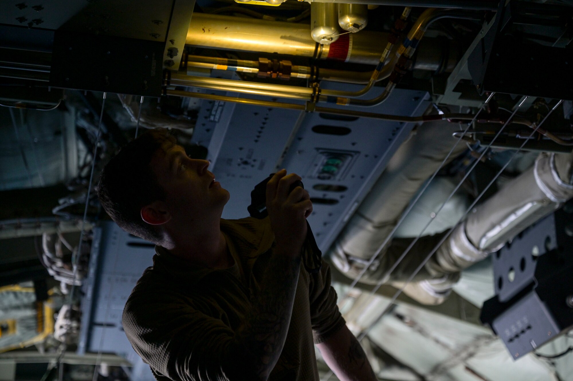 U.S. Air Force Staff Sgt. Jon Monroe II, a 1st Special Operations Aircraft Maintenance Squadron crew chief, conducts pre-flight inspections during Agile Ghost on Macdill Air Force Base.