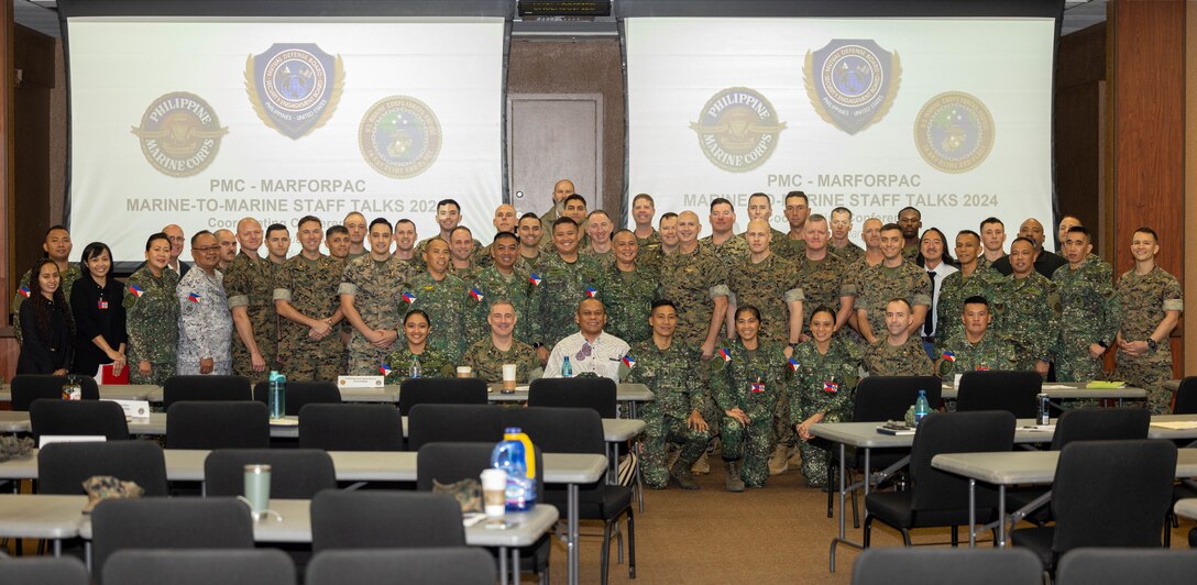 Pacific Marines with U.S. Marine Corps Forces, Pacific, and Philippine Marines pose for a group photo after staff talks on Camp H.M. Smith, Hawaii, Feb. 15, 2024. These annual meetings promote military interoperability, strengthen relationships, and expand military capabilities among participating forces in the advancement of a Free and Open Indo-Pacific. (U.S. Marine Corps photo by Lance Cpl. Matthew Benfield)