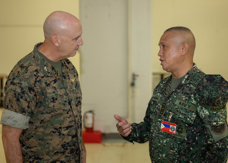 U.S. Marine Corps Col. Christopher Oliver, left, assistant chief of staff, G-5, U.S. Marine Corps Forces, Pacific, and Philippine Marine Corps Col. Bayani Curaming, Chief of Philippine Marine Staff, have a conversation during staff talks on Camp H.M. Smith, Hawaii, Feb. 13, 2024. These annual meetings promote military interoperability, strengthen relationships, and expand military capabilities among participating forces in the advancement of a Free and Open Indo-Pacific. (U.S. Marine Corps photo by Lance Cpl. Matthew Benfield)