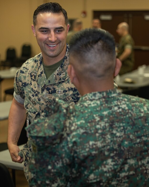 A U.S. Marine with Marine Corps Forces, Pacific, and a Philippine Marine have a conversation prior to staff talks on Camp H.M. Smith, Hawaii, Feb. 13, 2024. These annual meetings promote military interoperability, strengthen relationships, and expand military capabilities among participating forces in the advancement of a Free and Open Indo-Pacific. (U.S. Marine Corps photo by Lance Cpl. Matthew Benfield)