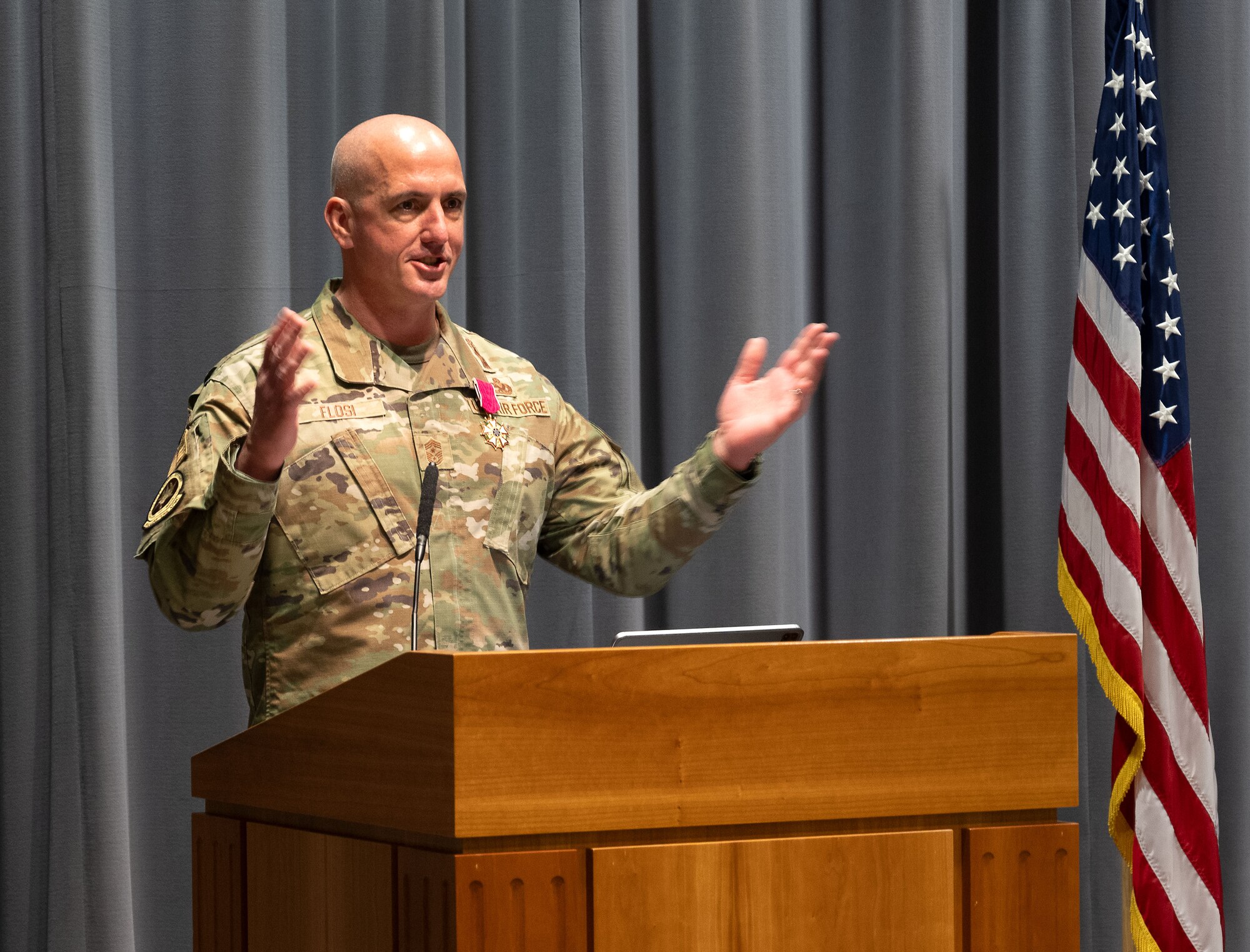 Chief Master Sgt. David A. Flosi, outgoing Air Force Materiel Command Chief Master Sergeant, addresses the crowd.