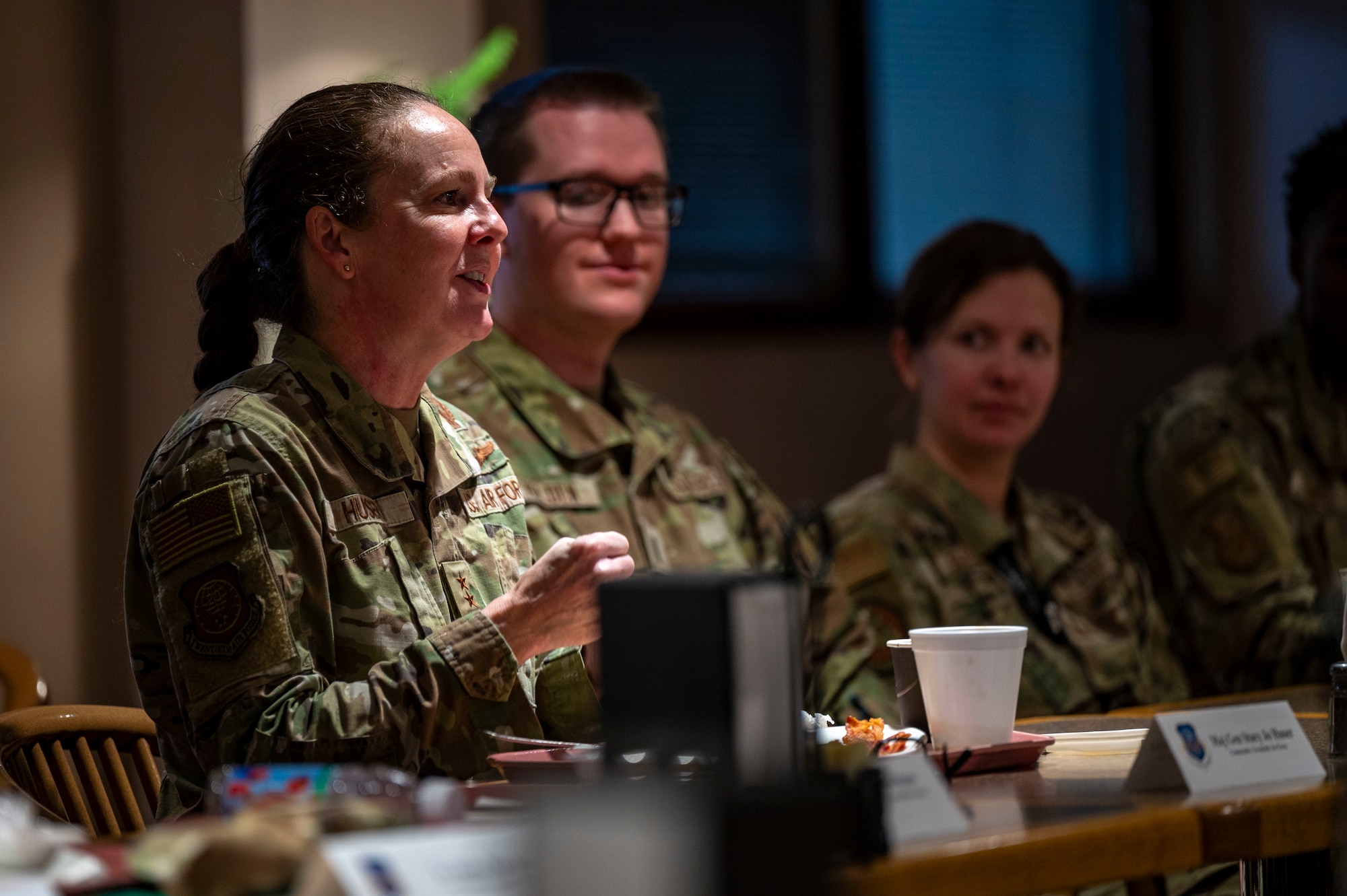 A woman speaks to a group.