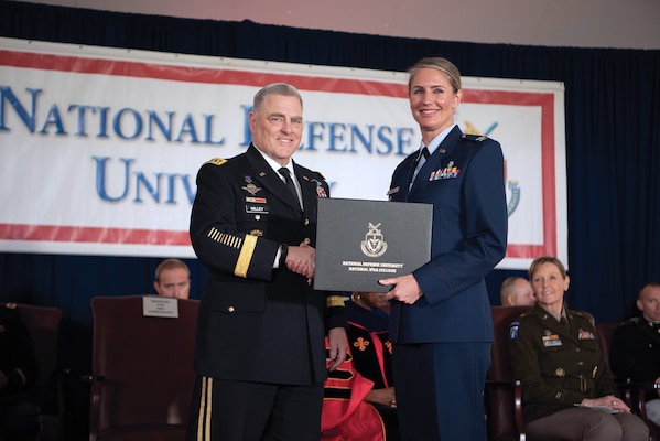 Then Chairman of the Joint Chiefs of Staff General Mark A. Milley congratulates National War College graduate during National Defense University’s 2023 graduation ceremony, June 8, 2023, on Fort Lesley J. McNair, Washington, DC (NDU Audio Visual)