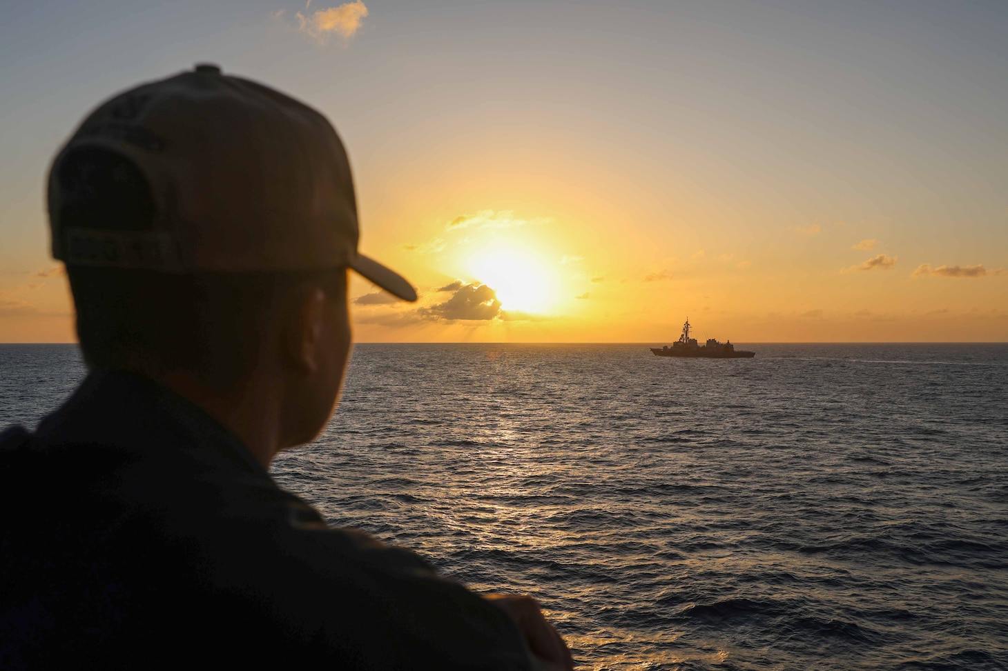 SOUTH CHINA SEA (Feb. 15, 2024) Boatswain’s Mate Second Class Kenneth Custudio, from San Diego, watches the Japanese Maritime Self-Defense Force (JMSDF), Hatakaze-class guided missile destroyer JS SHIMAKAZE and JS SUZUNAMI, conduct a bilateral exercise while aboard the Arleigh Burke-class guided-missile destroyer USS John Finn (DDG 113) in the South China Sea, Feb. 15. John Finn is forward-deployed and assigned to Commander, Task Force (CTF) 71/Destroyer Squadron (DESRON) 15, the Navy’s largest DESRON and the U.S. 7th Fleet’s principal surface force. (U.S. Navy photo by Mass Communication Specialist 2nd Class Justin Stack)