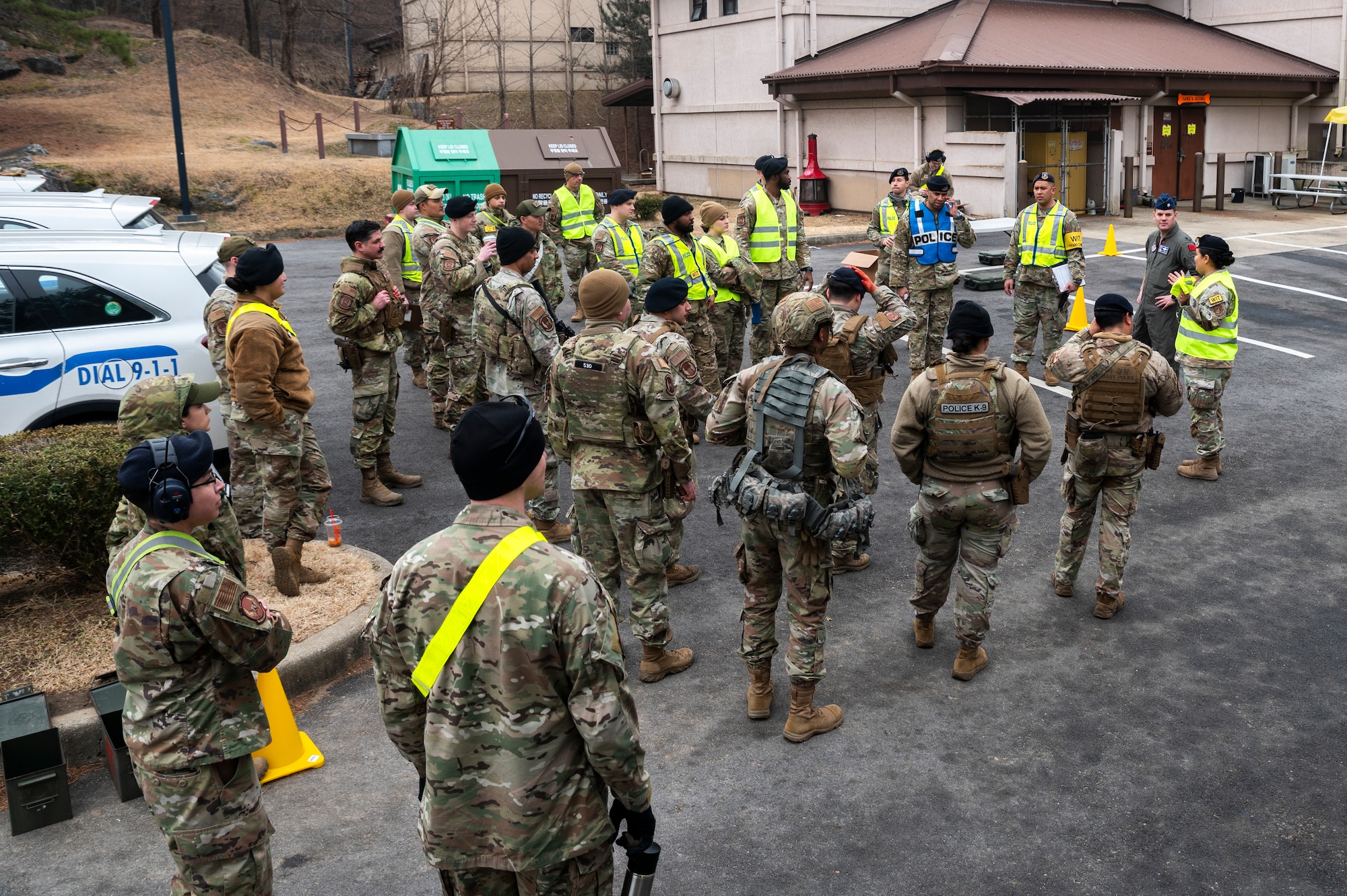 U.S. Airmen from the 51st Security Forces Squadron gather for a feedback session following a simulated active shooter response training at Osan Air Base, Republic of Korea, Feb. 14, 2024. Contingency training and realistic scenarios allow defenders to be prepared to fight tonight to execute daily Osan missions. (U.S. Air Force photo by Senior Airman Trevor Gordnier)
