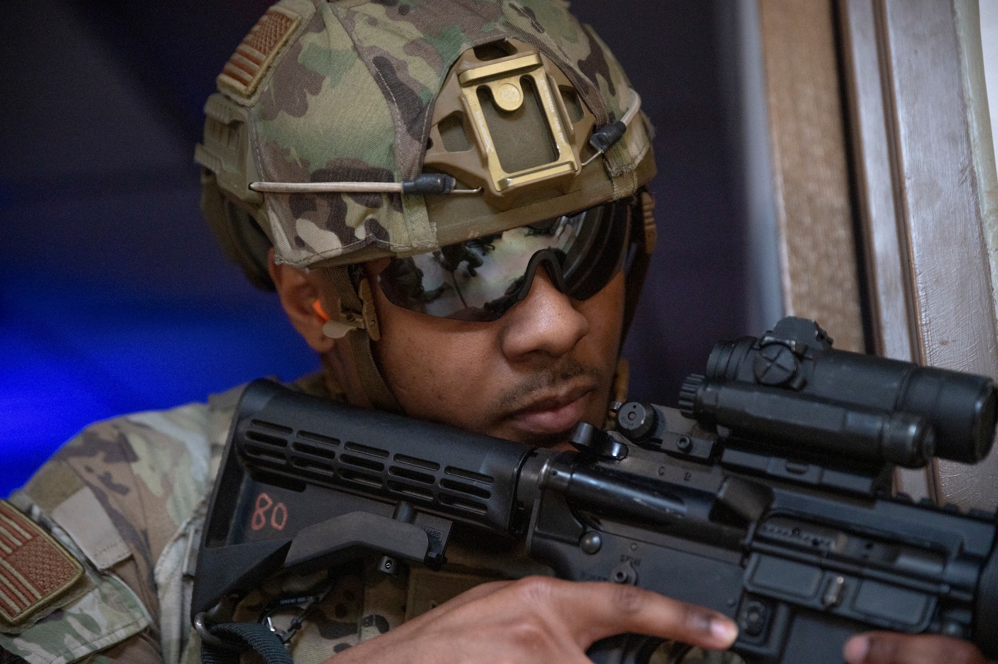 U.S. Air Force Senior Airman Andrew Smith, 51st Security Forces Squadron defender, covers a corner while sweeping a building during a simulated active shooter response training at Osan Air Base, Republic of Korea, Feb. 14, 2024. This training provides defenders with systematic, realistic scenario-based preparation, enhancing their readiness and ensuring they are always mission-ready. (U.S. Air Force photo by Senior Airman Trevor Gordnier)