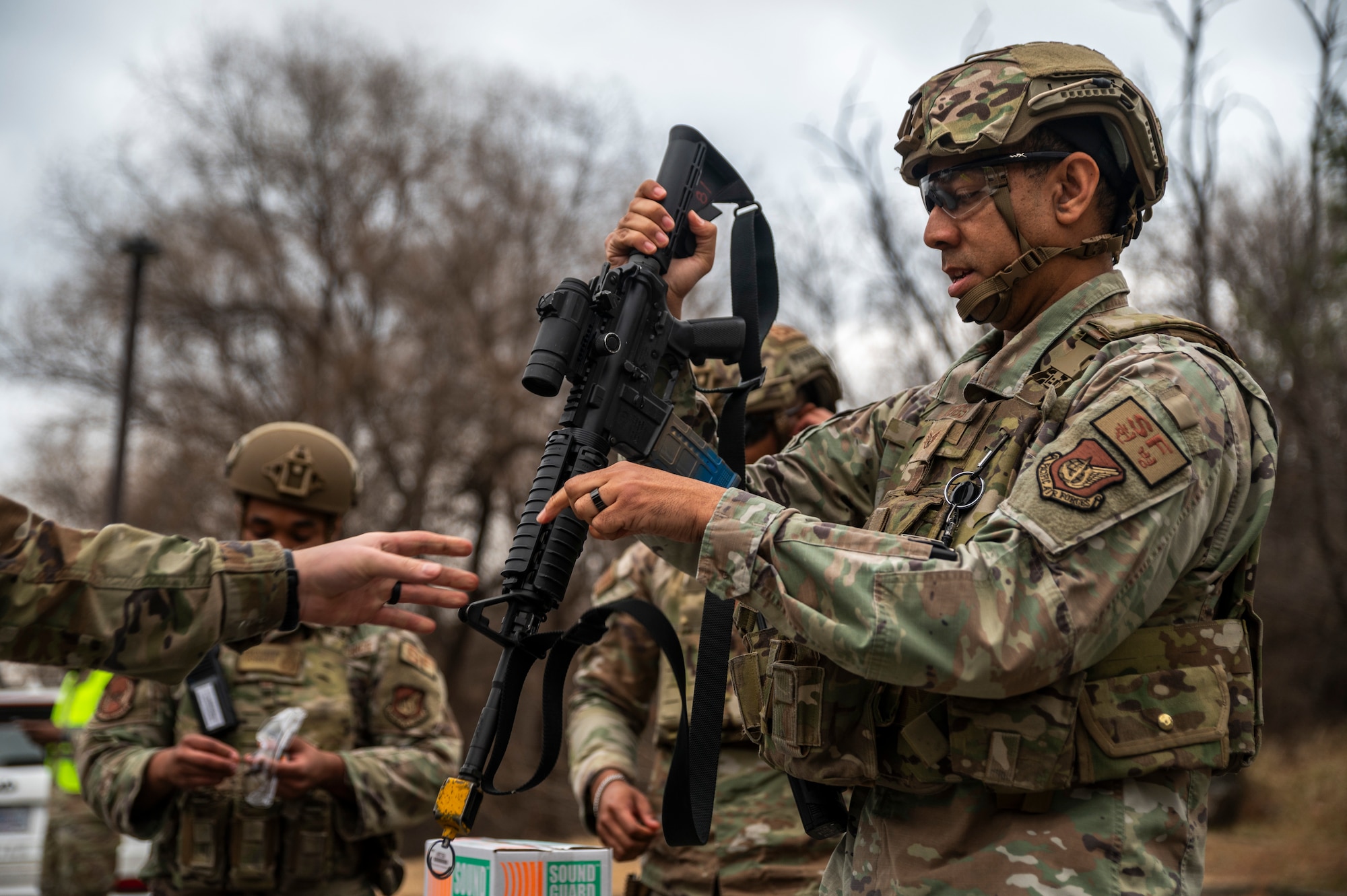 U.S. Air Force Staff Sgt. Terry Biggs, 51st Security Forces Squadron defender, equips a training rifle before responding to a simulated active shooter scenario at Osan Air Base, Republic of Korea, Feb. 14, 2024. This training enables the 51st SFS to evaluate their response capabilities in a simulated active shooter situation, ensuring readiness to react effectively. (U.S. Air Force photo by Senior Airman Trevor Gordnier)
