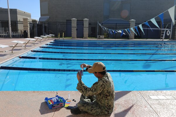 LEMOORE, Calif. (Feb. 15, 2024) Hospital Corpsman 2nd Class ReiCharles Quioco is testing the Naval Air Station Lemoore gym pool water for a public health inspection. He has been working at Naval Health Clinic Lemoore in the public health directorate for about one year.  (U.S. Navy photo by Elaine M. Heirigs/Released)