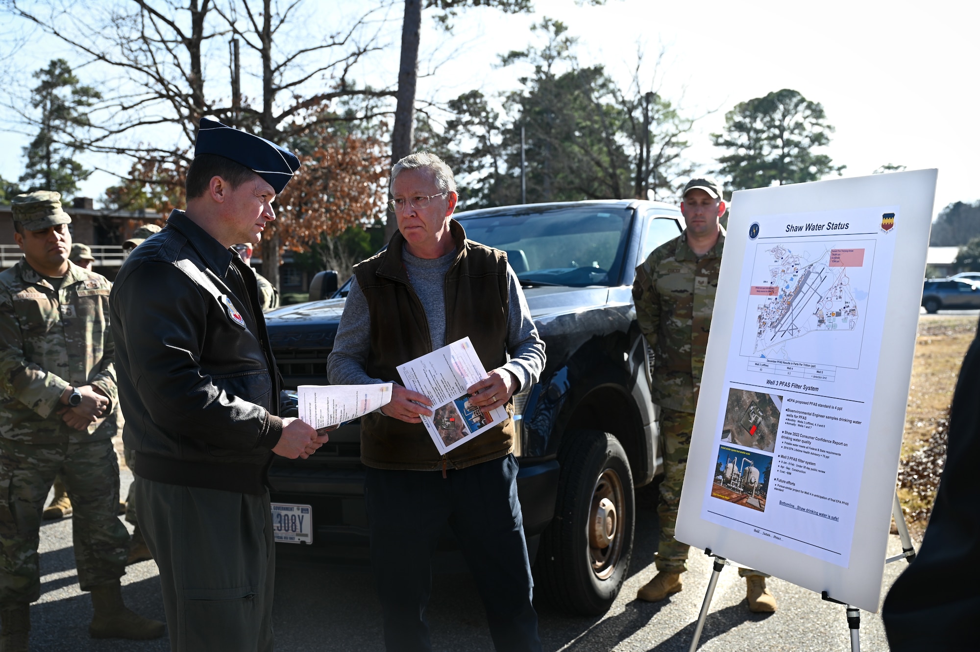 U.S. Air Force Maj. Gen. listens to a brief by a civil engineer