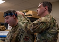 Airmen from the 59th Medical Wing practice detecting seizures during a national disaster response exercise on Camp Bramble at Joint Base San Antonio-Lackland, Texas, March 3, 2023. Texas A&M University has been conducting emergency response training for 15 years and, for the first time, collaborated with the 59th MDW. Being able to train inflight and utilize Disaster City by collaborating with Texas A&M gives medics a way to hone their skills, prepare for national emergencies and remain ready medics. (U.S. Air Force photo by Senior Airman Melody Bordeaux)