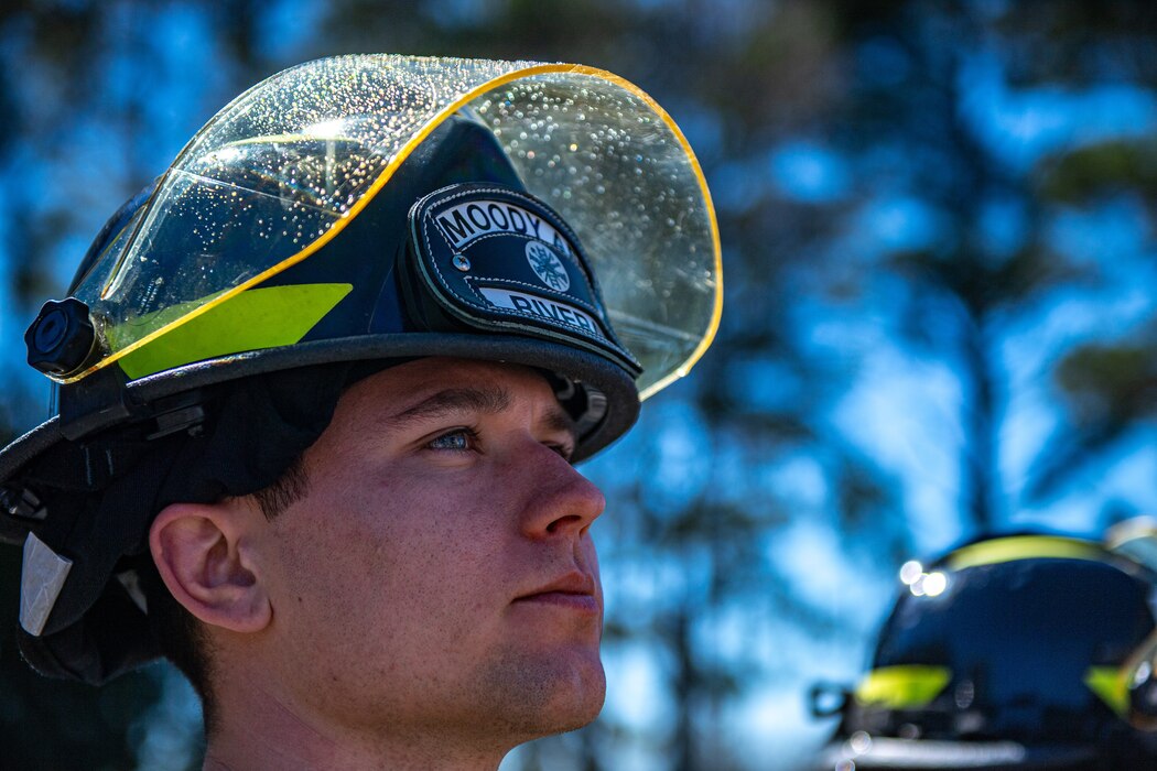 a firefighter looks up