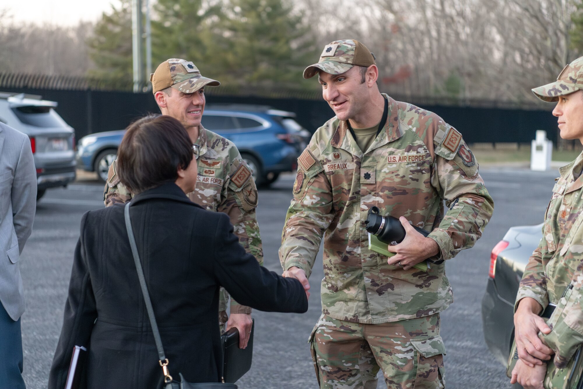 Heidi Shyu, Under Secretary of Defense for Research and Engineering, is greeted by Lt. Col. Bradley Breaux, commander of the 718th Test Squadron, and other installation personnel and leadership as she arrives for her Dec. 11, 2023, visit to Arnold Air Force Base, Tenn. During her visit to Arnold, headquarters of Arnold Engineering Development Complex, Shyu toured several test facilities and was briefed on test capabilities at Arnold. (U.S. Air Force photo by Keith Thornburgh)