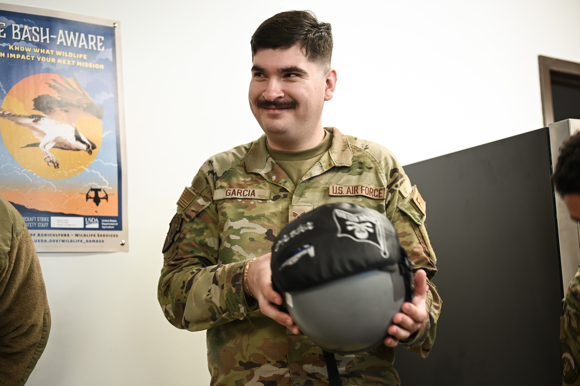 U.S. Air Force Senior Airman Philip Payne, 47th Operation Support Squadron air traffic controller, speaks to a group of Airmen about working in the radar approach control system (RAPCON) during a flight operations immersion tour at Laughlin Air Force Base, Texas, Feb. 1, 2024.