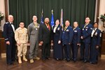 Col. William Gutermuth, left, 433rd Airlift Wing commander, and Chief Master Sgt. Takesha Williams, right, 433rd AW command chief, stand with the annual wing award winners after the awards ceremony Feb. 3, 2024, at Joint Base San Antonio-Lackland, Texas. (U.S. Air Force photo by Tech. Sgt. Jacob Lewis)