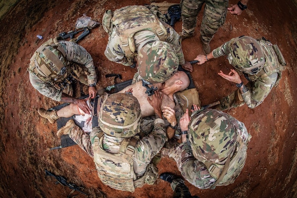 Special Amphibious Reconnaissance Corpsmen assigned to November Company, 3rd Raider Battalion, provide tactical combat casualty care training to Soldiers of 1st Battalion, 102nd Cavalry Regiment, during routine deployment to Somalia, August 24, 2019 (U.S. Navy/Patrick W. Mullen III)