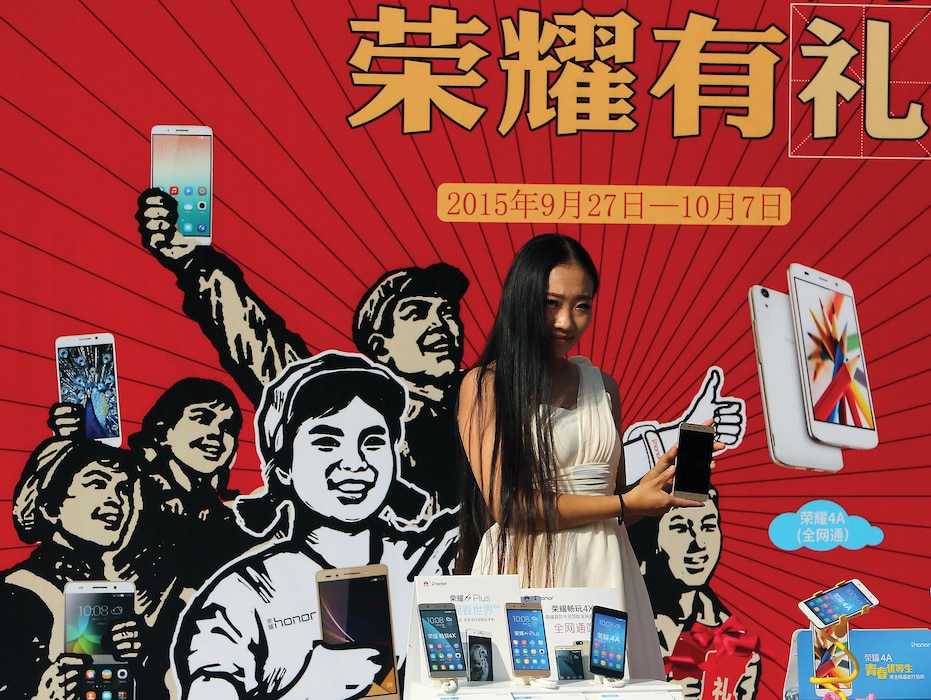 Chinese model promotes smartphone outside electronics center notorious for selling fake, gray market, and pirated electronics