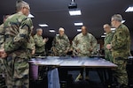General Darryl Williams discusses mission command execution with senior officers from NATO HQ Allied Rapid Reaction Corps during Steadfast Jupiter 23