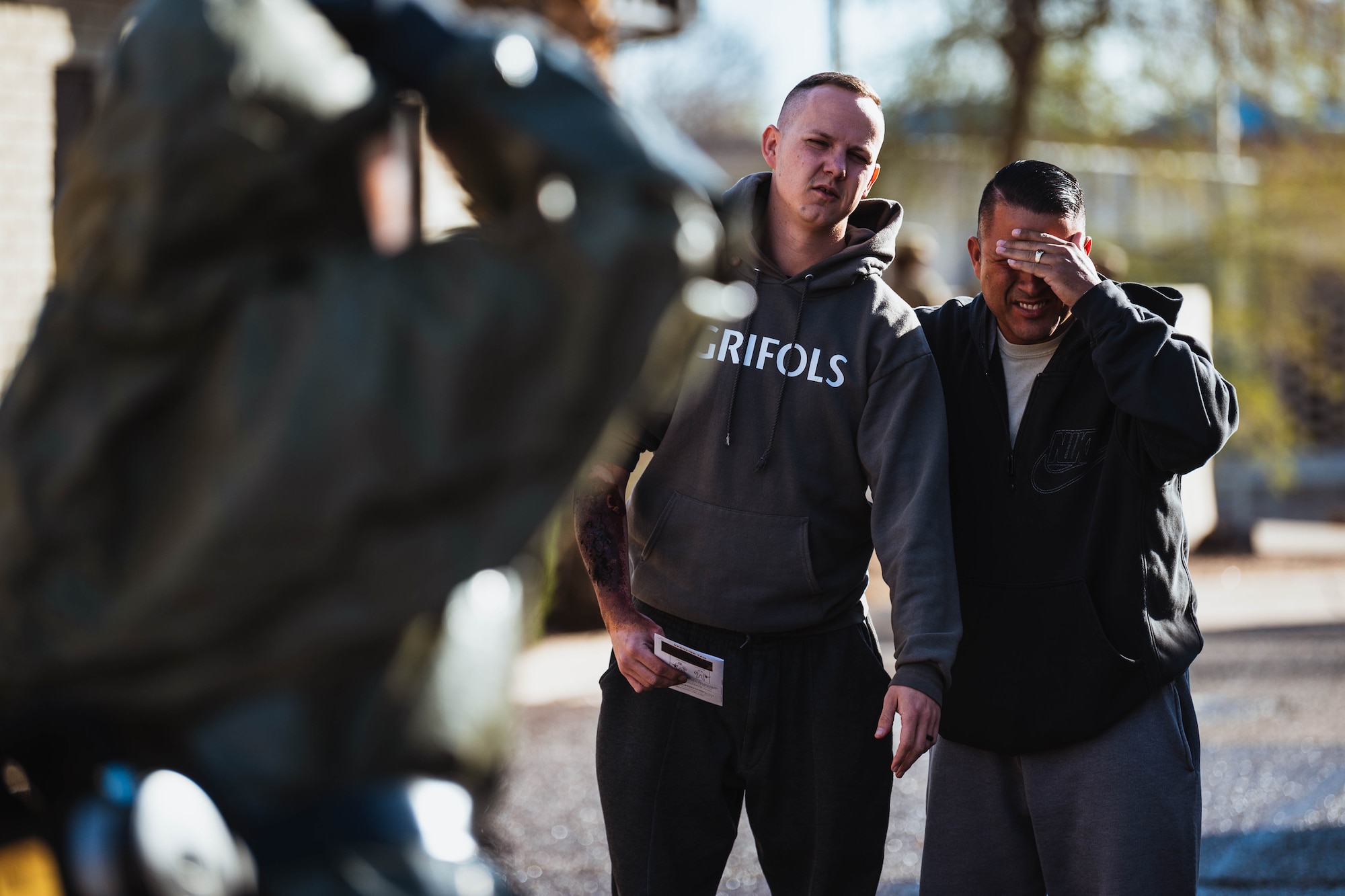 Moulage patients approach a 56th Medical Group Airman during exercise Ready Eagle II.