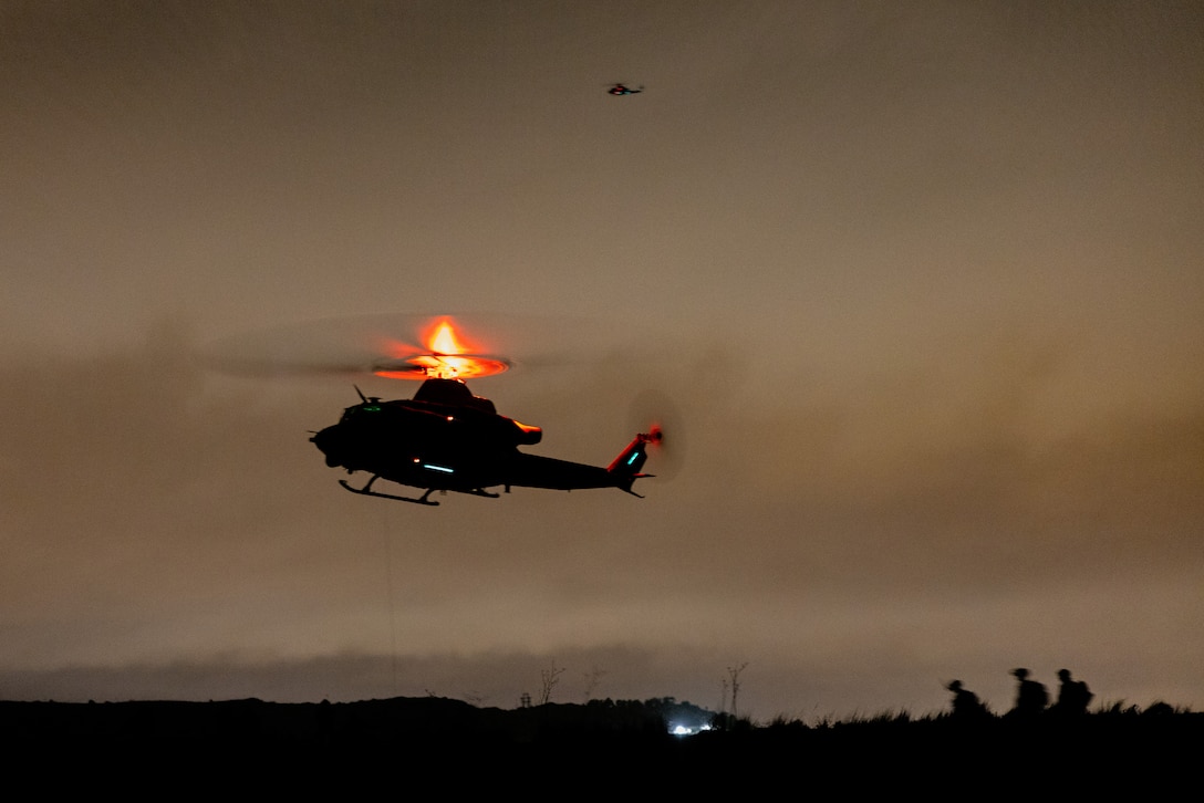 A U.S. Marine Corps UH-1Y Venom assigned to Marine Light Attack Helicopter Squadron 169, Marine Aircraft Group 39, 3rd Marine Aircraft Wing, prepares to hoist a simulated casualty recovered by Marines with Weapons Company, 2nd Battalion, 5th Marine Regiment, 1st Marine Division, during a tactical recovery of aircraft and personnel course hosted by Expeditionary Operations Training Group, I Marine Expeditionary Force, at Marine Corps Base Camp Pendleton, California, Feb. 7, 2024. The TRAP course is designed to develop the capabilities of Marines to recover aircraft, personnel and equipment in austere environments. EOTG is a section of the I MEF command element that trains and evaluates deploying Marine Expeditionary Units, and other designated forces, in select individual and collective tasks to prepare them to support geographic combatant commands. (U.S. Marine Corps photo by Cpl. Earik Barton)