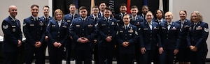 Airman Leadership School Class 24-B prepares to graduate at the Powell Event Center, Goodfellow Air Force Base, Texas, Feb. 15, 2024. The class gathered for a group photo to commemorate their achievement and celebrate the long hours spent becoming first-line supervisors. (U.S. Air Force photo by Senior Airman Ethan Sherwood)