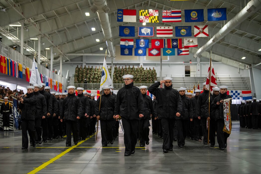 A division marches inside Midway Ceremonial Drill Hall during the Pass in Review at Recruit Training Command.