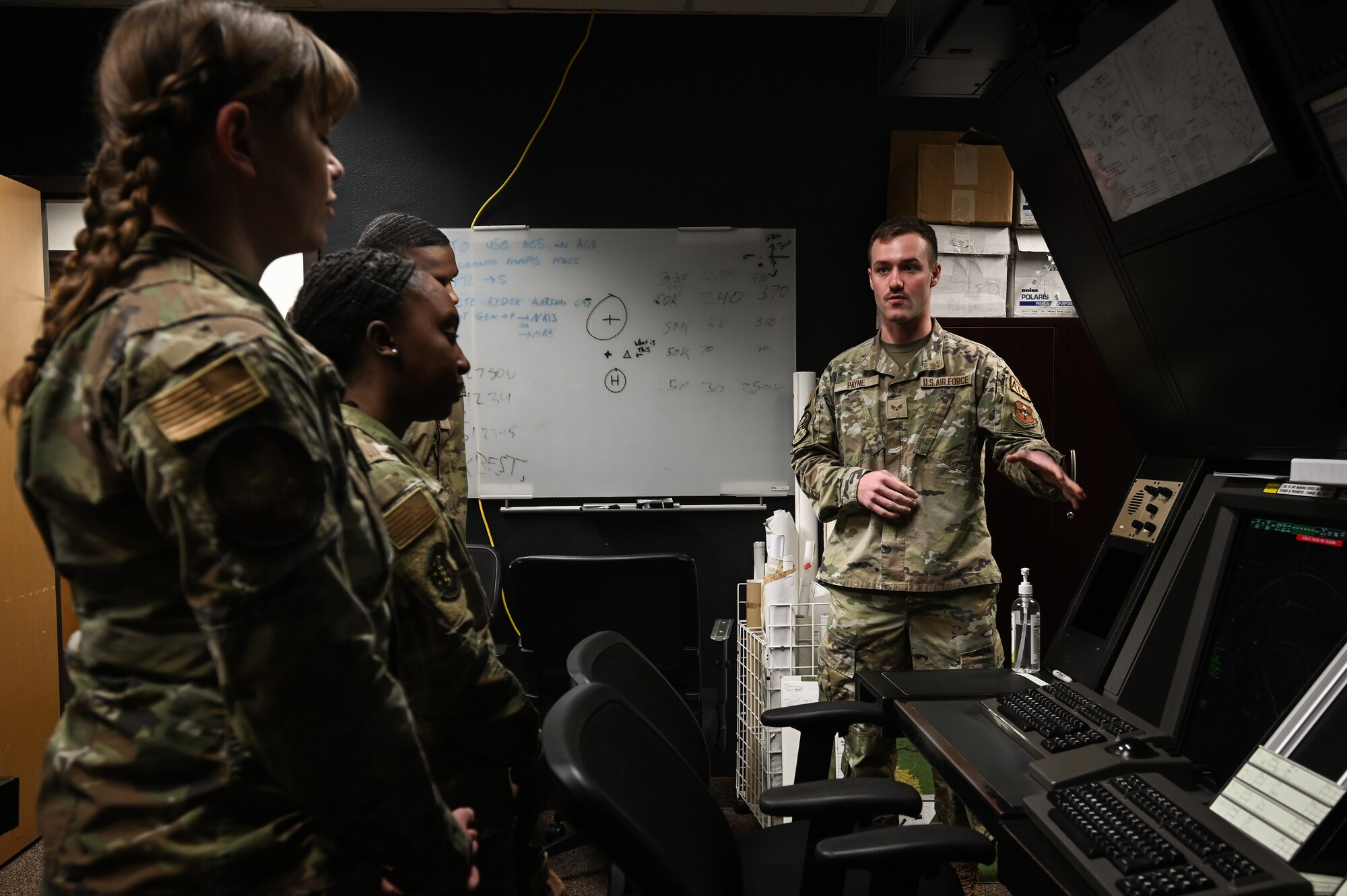 U.S. Air Force Senior Airman Philip Payne, 47th Operation Support Squadron air traffic controller, speaks to a group of Airmen about working in the radar approach control system (RAPCON) during a flight operations immersion tour at Laughlin Air Force Base, Texas, Feb. 1, 2024.