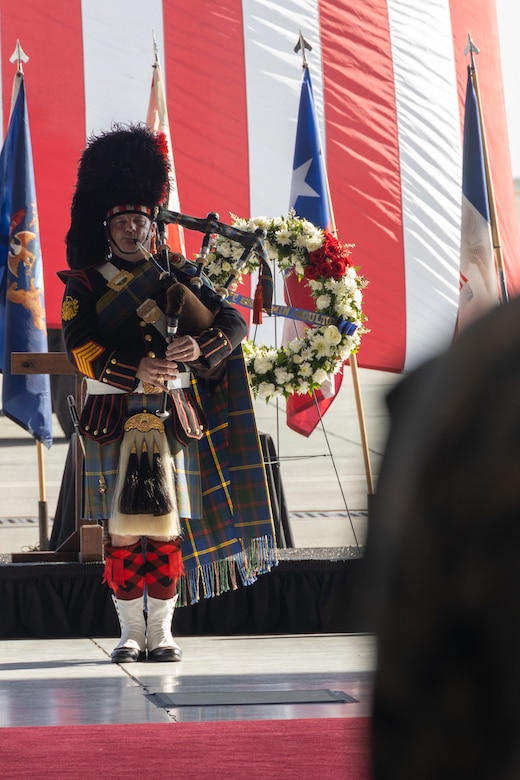 Retired U.S. Marine Corps Gunnery Sgt. Joel Daniel, a professional musician, plays the bagpipes at a memorial ceremony honoring five Marines of Marine Heavy Helicopter Squadron (HMH) 361, Marine Aircraft Group 16, 3rd Marine Aircraft Wing at Marine Corps Air Station Miramar, California, Feb. 16, 2024. More than 550 Marines, family and friends gathered to pay tribute to the five Marines who lost their lives as the result of a CH-53E mishap on Feb. 6, 2024, in Pine Valley, California. (U.S. Marine Corps photo by Staff Sgt. Antonio De La Fuente)