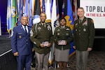 From left, Senior Enlisted Advisor Tony Whitehead, SEA to the chief, National Guard Bureau; Sgt. Maj. Alan Thomas, operations sergeant major, Indiana National Guard; Chief Warrant Officer 3 Regina Carrell, a senior strategic intelligence analyst at the National Guard Bureau, and Army Gen. Daniel Hokanson, chief, National Guard Bureau, at the Black Engineer of the Year Award Science, Technology, Engineering and Mathematics Stars and Stripes dinner and reception, Baltimore, Maryland, Feb. 16, 2024. The National Guard Bureau was the featured military organization of the 2024 Stars and Stripes event.