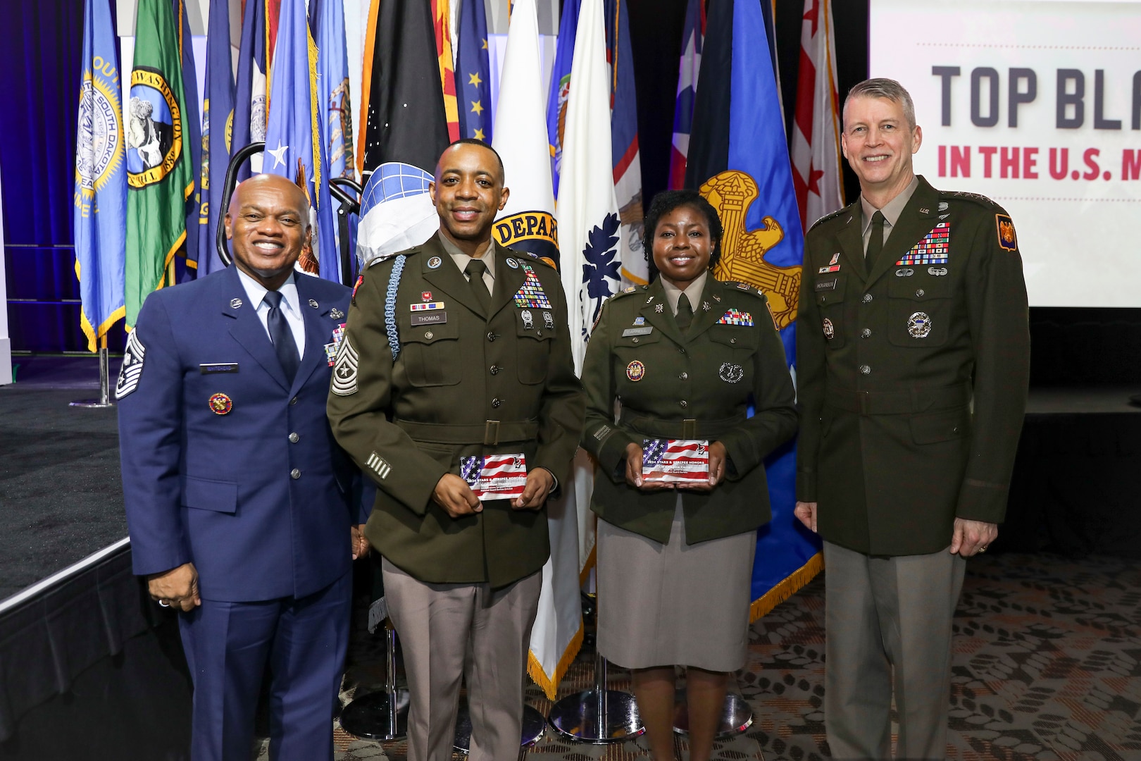 From left, Senior Enlisted Advisor Tony Whitehead, SEA to the chief, National Guard Bureau; Sgt. Maj. Alan Thomas, operations sergeant major, Indiana National Guard; Chief Warrant Officer 3 Regina Carrell, a senior strategic intelligence analyst at the National Guard Bureau, and Army Gen. Daniel Hokanson, chief, National Guard Bureau, at the Black Engineer of the Year Award Science, Technology, Engineering and Mathematics Stars and Stripes dinner and reception, Baltimore, Maryland, Feb. 16, 2024. The National Guard Bureau was the featured military organization of the 2024 Stars and Stripes event.