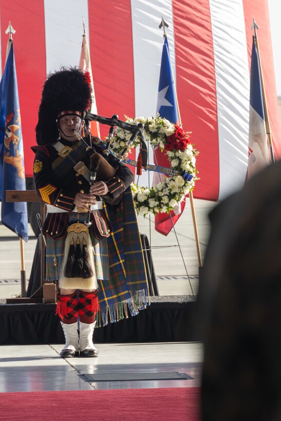 Retired U.S. Marine Corps Gunnery Sgt. Joel Daniel, a professional musician, plays the bagpipes at a memorial ceremony honoring five Marines of Marine Heavy Helicopter Squadron (HMH) 361, Marine Aircraft Group 16, 3rd Marine Aircraft Wing at Marine Corps Air Station Miramar, California, Feb. 16, 2024. More than 550 Marines, family and friends gathered to pay tribute to the five Marines who lost their lives as the result of a CH-53E mishap on Feb. 6, 2024, in Pine Valley, California. (U.S. Marine Corps photo by Staff Sgt. Antonio De La Fuente)