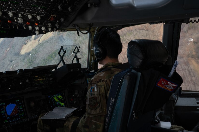 U.S. Air Force 1st Lt. Seung Woo Ban, 6th Airlift Squadron C-17 pilot, flies a C-17 Globemaster III during the Tactics Advancement Course at Joint Base Langley-Eustis, Va., Feb. 7, 2024. Airmen assigned to the 6th Airlift Squadron loaded cargo onto the C-17 in order to provide support for the F-22 Raptors at JBLE. The advancements course postures Air Mobility Command Airmen to execute agile operations on a global scale. (U.S. Air Force photo by Airman 1st Class Aidan Thompson)