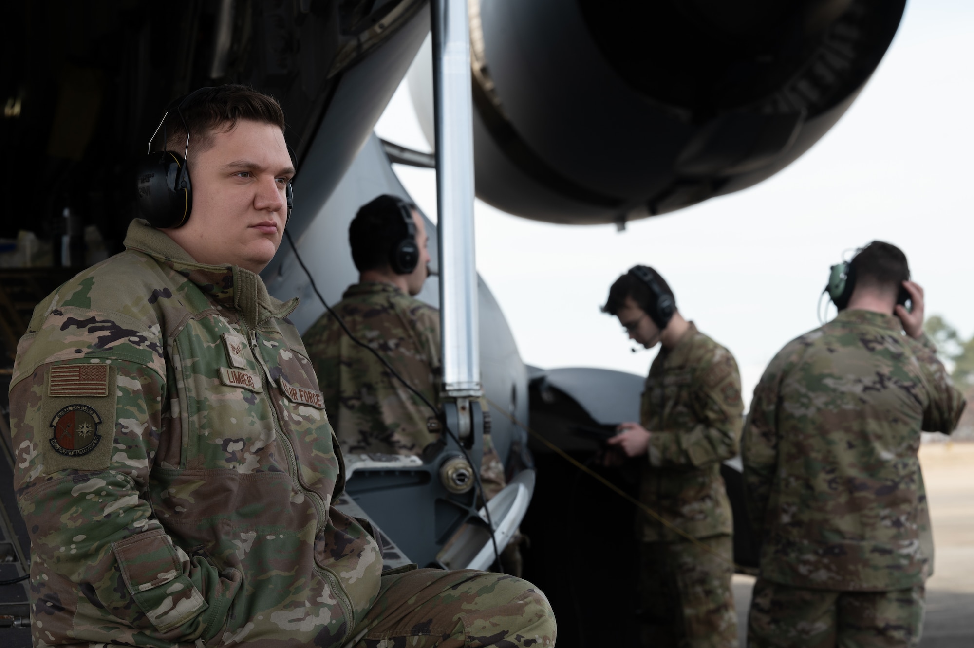 U.S. Air Force Senior Airman Jordan Limberg, 6th Airlift Squadron C-17 flying crew chief, refuels a C-17 Globemaster III during the Tactics Advancement Course at Joint Base Langley-Eustis, Va., Feb. 7, 2024. Airmen assigned to the 6 AS loaded cargo onto the C-17 in order to provide support for the F-22 Raptors at JBLE. The advancements course postures Air Mobility Command Airmen to execute agile operations on a global scale. (U.S. Air Force photo by Airman 1st Class Aidan Thompson)