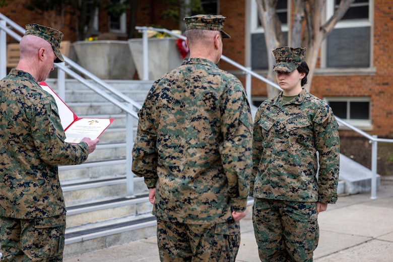 U.S. Marine Corps Lance Cpl. Marina Camponescki, a Haverhill, Massachusetts native and finance technician with Programs and Resources Department, Headquarters Marine Corps, right, receives a Navy and Marine Corps Achievement Medal during her award ceremony on Marine Corps Base Quantico, Virginia, Feb. 9, 2024. Camponescki was recently selected as the Marine Corps Installations Command Marine of the Year and was awarded a Navy and Marine Corps Achievement Medal for her superior work ethic. (U.S. Marine Corps photo by Lance Cpl. Joaquin Dela Torre)
