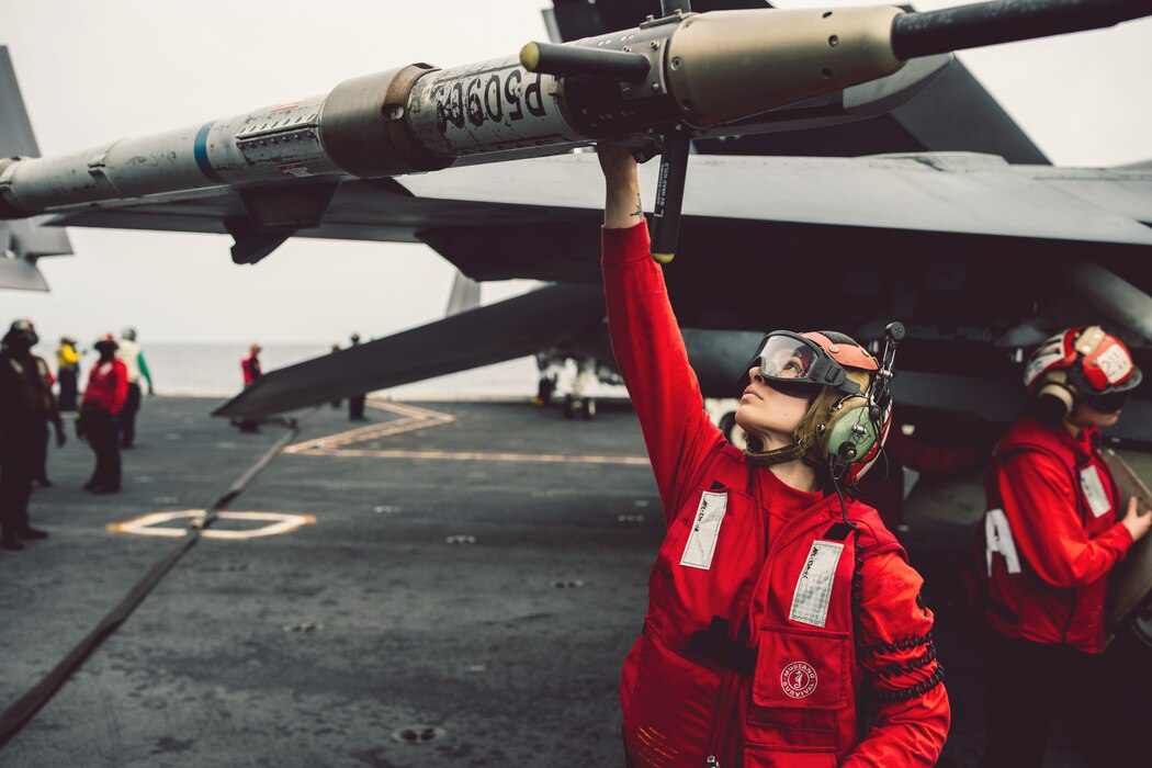 AO2 Amanda Cabral, from VFA-103, inspects training ordnance on the flight deck aboard USS George Washington (CVN 73) in the Atlantic Ocean.