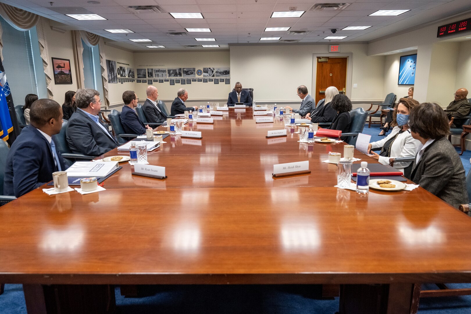 People sit at a conference table.