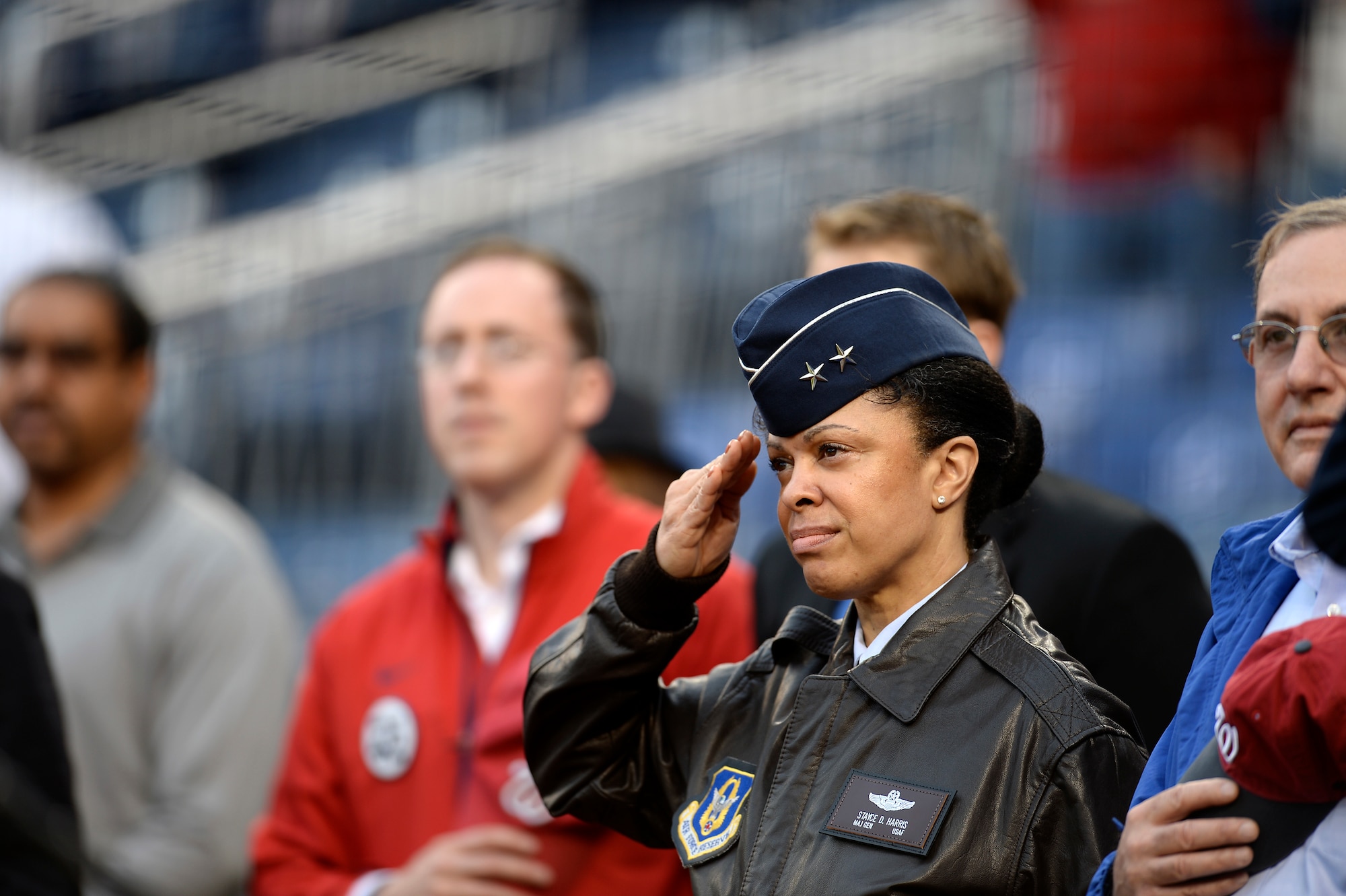 Maj. Gen. Stayce D. Harris saluting.