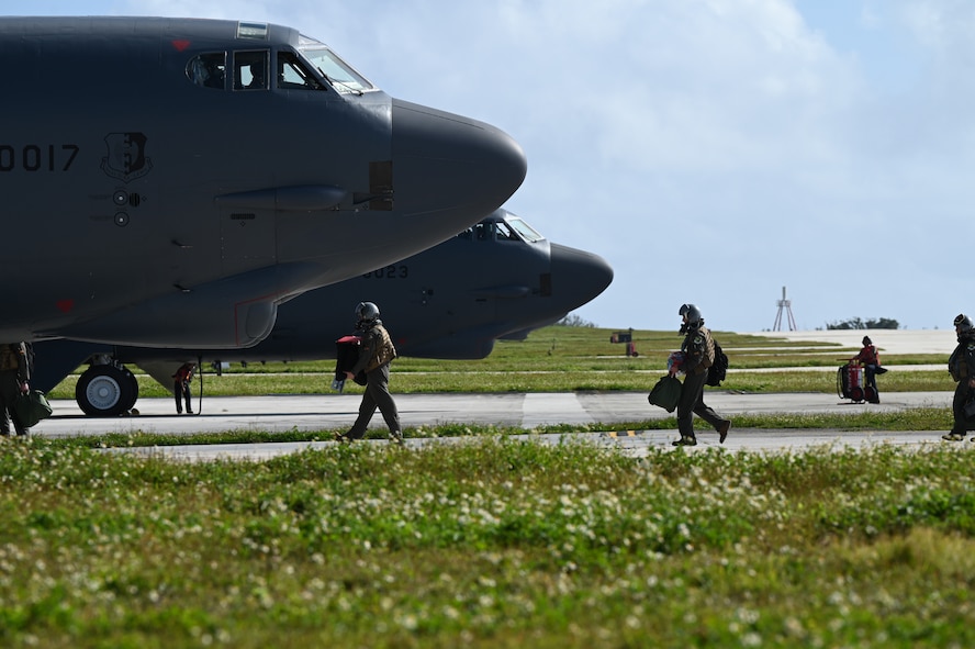 U.S. Air Force aircrew assigned to the 23rd Expeditionary Bomb Squadron prepare to board the B-52H Stratofortress at Andersen Air Force Base, Guam to fly a routine Bomber Task Force training mission, Feb. 3, 2024. The United States maintains a strong, credible bomber force that enhances the security and stability of Allies and partners. (U.S. Air Force photo by Master Sgt. Amy Picard)