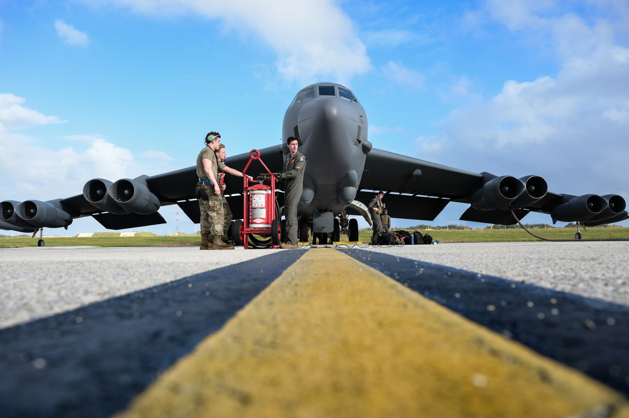 U.S. Air Force Capt. Jonathan Hutnicki, pilot, assigned to the 23rd Expeditionary Bomb Squadron and Airmen from the 5th Maintenance Squadron prepare for a routine Bomber Task Force mission at Andersen Air Force Base, Guam, Feb. 16, 2024. Bomber missions provide opportunities to train and work with our Allies and partners in joint and coalition operations and exercises. (U.S. Air Force photo by Master Sgt. Amy Picard)