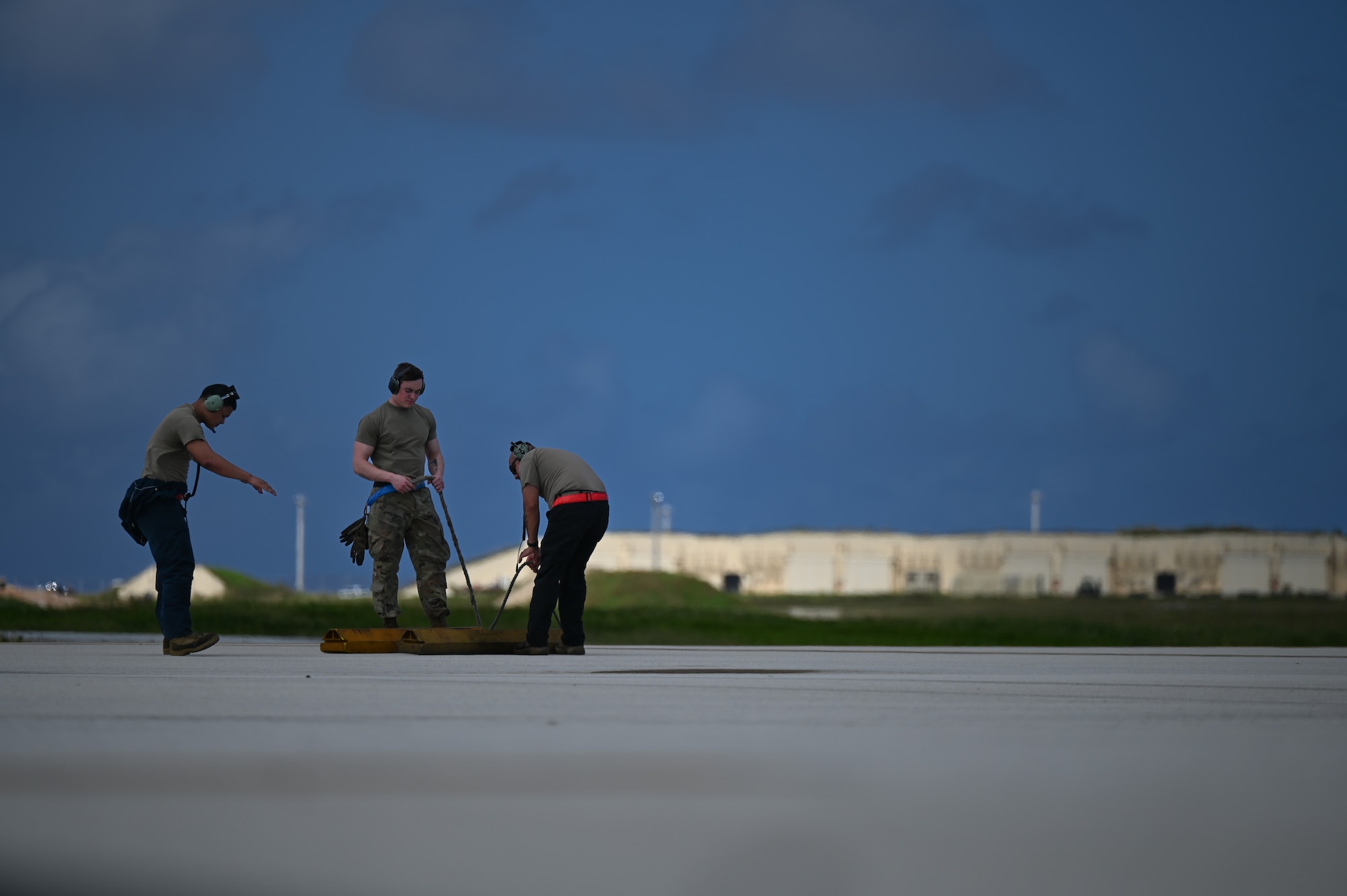 U.S. Air Force Airmen wait as the B-52H Stratofortress assigned to the 23rd Expeditionary Bomb Squadron taxi’s in at Andersen Air Force Base, Guam, Feb. 1, 2024. Bomber Task Force missions, such as these, validate the always-ready, global strike capability of U.S. Strategic Command and enable Airmen to maintain a high state of proficiency and readiness. (U.S. Air Force photo by Master Sgt. Amy Picard)