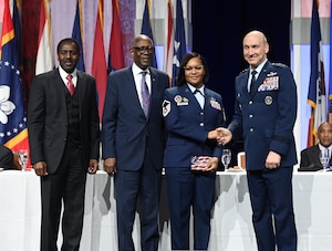 U.S. Space Force Vice Chief of Space Operations Gen. Michael Guetlein (right) presents an award to U.S. Space Force Brig. Gen. Jacob Middleton during the 2024 Black Engineer of the Year dinner and awards ceremony, Baltimore, Md., Feb 16, 2024. The event honored top African American military leaders in science, technology, engineering and math. (U.S. Air Force photo by Andy Morataya)