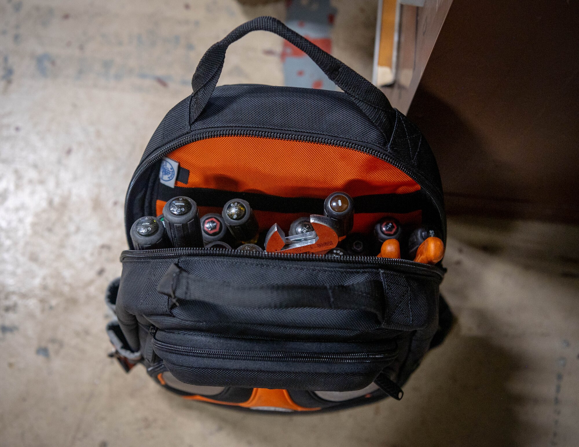 An unzipped equipment bag.