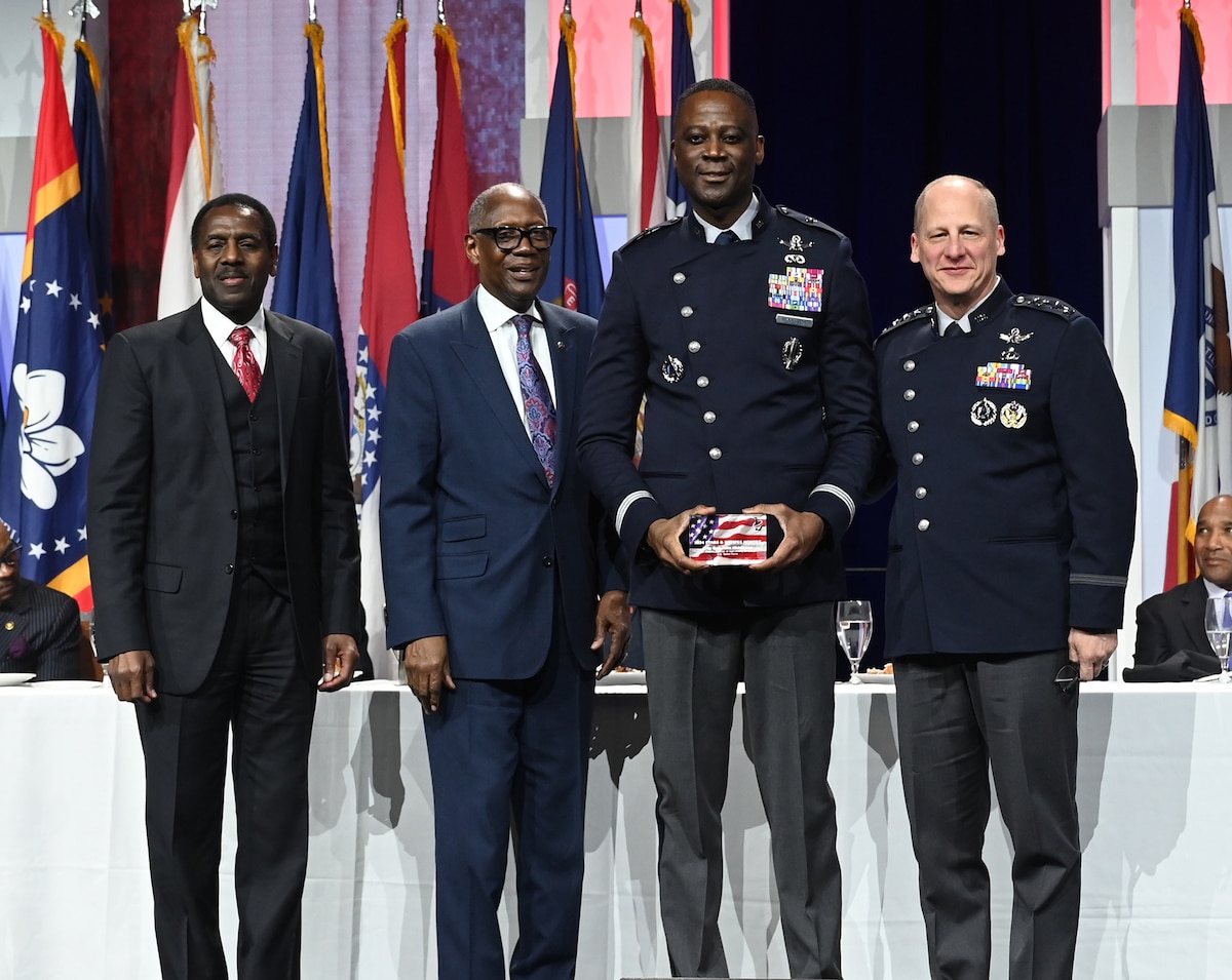 U.S. Space Force Vice Chief of Space Operations Gen. Michael Guetlein (right) presents an award to U.S. Space Force Brig. Gen. Jacob Middleton during the 2024 Black Engineer of the Year dinner and awards ceremony, Baltimore, Md., Feb 16, 2024. The event honored top African American military leaders in science, technology, engineering and math. (U.S. Air Force photo by Andy Morataya)