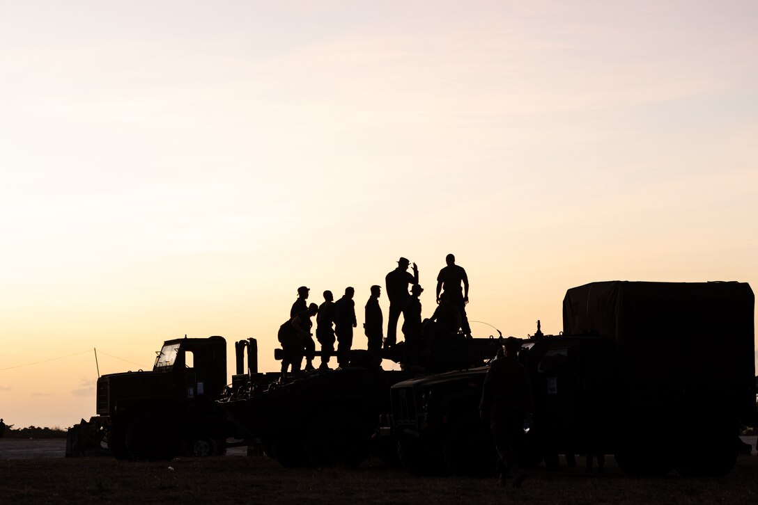 U.S. Marines with 3d Littoral Logistics Battalion, 3d Marine Littoral Regiment, 3d Marine Division, and Philippine Marines with 4th Marine Brigade, stand on top of a Light Armored Vechicle-150 during a multilateral static display during KAMANDAG 7 at Camp Cape Bojeador, Philippines, Nov. 16, 2023. KAMANDAG is an annual Philippine Marine Corps and U.S. Marine Corps-led exercise aimed at improving multinational readiness and mutual capabilities in the advancement of a Free and Open Indo-Pacific. This year marks the seventh iteration of this exercise and includes participants from Japan, the Republic of Korea, and observers from the United Kingdom. (U.S. Marine Corps photo by Cpl. Malia Sparks)