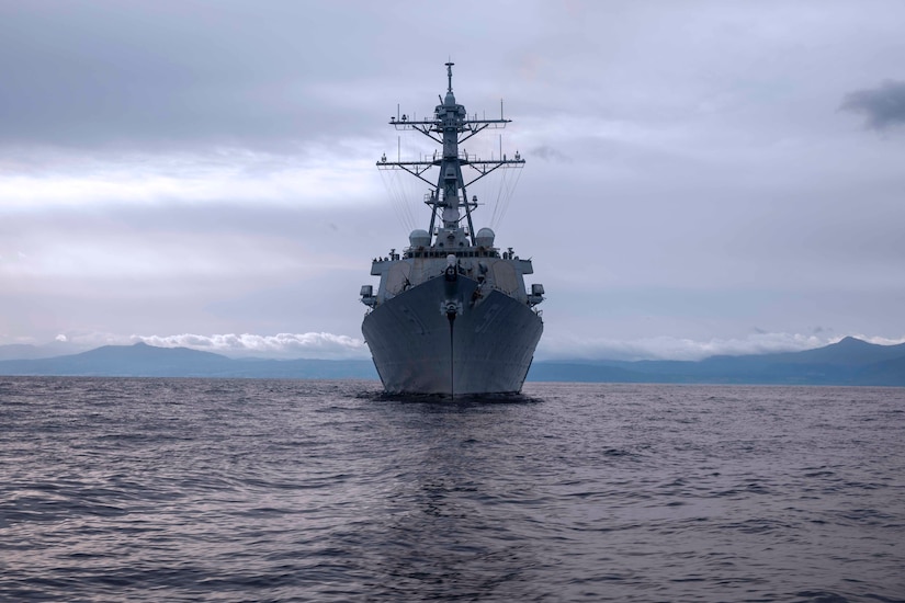 A ship transits a body of water.