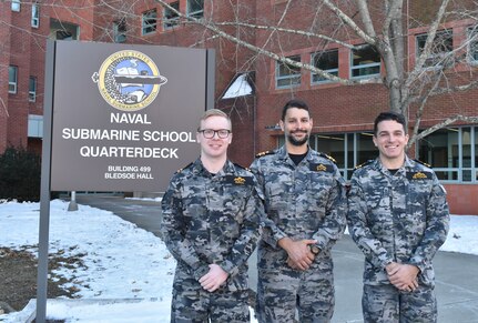 (240202-N-KB946-1014)( NEW LONDON, Conn --  Royal Australian Navy Lt. William Hall, Lt. Cmdr. Adam Klyne, and Lt. Cmdr. James Heydon are the first Aussie officers to attend the U.S. Naval Submarine School’s Submarine Officer Basic School in Groton, Connecticut, Feb. 20, 2024. These sailors are part of a decades-long plan that will see Australia fielding its own fleet of nuclear-powered submarines.