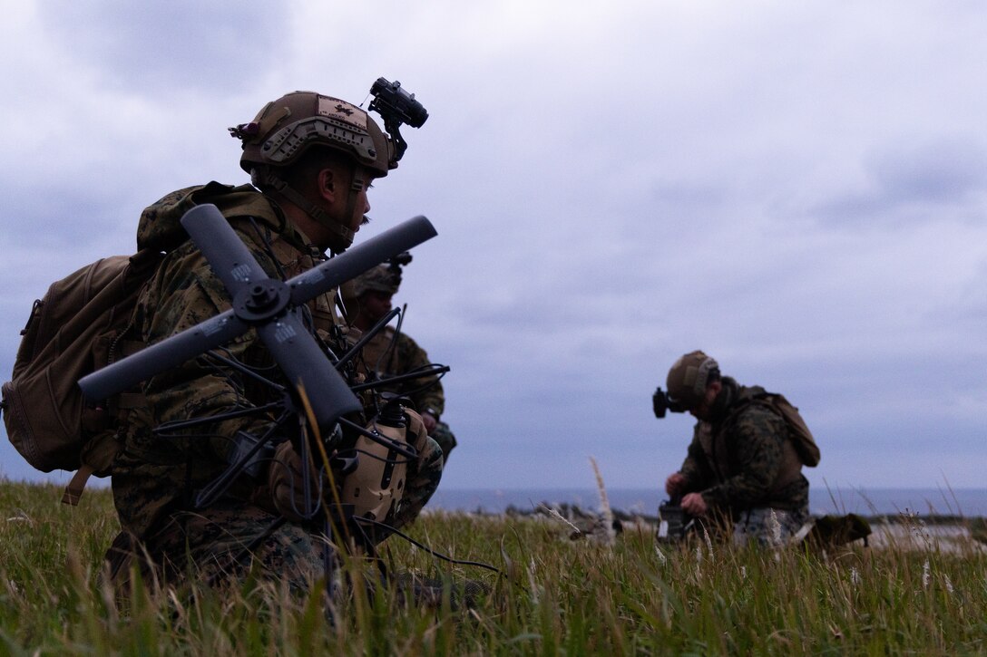 U.S. Marines with 5th Air Naval Gunfire Liaison Company, III Marine Expeditionary Force Information Group, conduct a patrol during a communications field exercise, Rapid Tanto, at Ie Shima, Okinawa, Japan, Feb. 6, 2024. The patrol allowed Marines to conduct communication training including 9-line casualty evacuation with field radios. 5th ANGLICO and 3rd Intelligence Battalion demonstrated proficiency in planning, coordination, and execution of dynamic targeting capable of supporting maritime campaigns in an increasingly contested Indo-Pacific. (U.S. Marine Corps photo by Cpl. William Wallace)