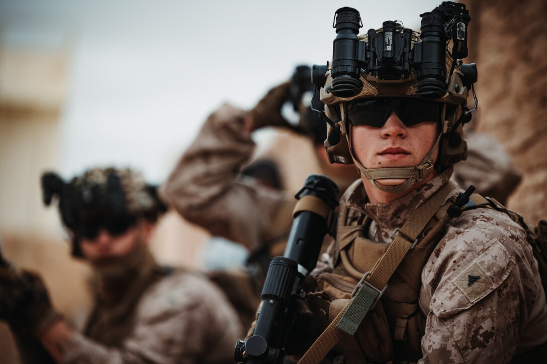 U.S. Marine Corps Lance Cpl. Aidan Wheeler, a Charleston, South Carolina native, infantry Marine with 2nd Battalion, 6th Marine Regiment, 2nd Marine Division, prepares to clear a building during an Adversary Force Exercise as part of Service Level Training Exercise 2-24 at Range 220, Marine Corps Air-Ground Combat Center, Twentynine Palms, California, Feb. 1, 2024. The purpose of AFX is to create a credible, realistic threat for the exercise forces participating in SLTE 2-24 to engage against during the upcoming Marine Air-Ground Task Force Warfighting Exercise in a force-on-force, unscripted wargame. (U.S. Marine Corps photo by Lance Cpl. Richard PerezGarcia)