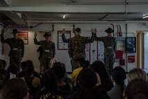U.S. Marines with Support Battalion, Recruit Training Regiment, conduct a mock senior drill instructor oath for spouses taking part in the "In Their Boots" event at Marine Corps Recruit Depot San Diego, Feb. 16, 2024. In Their Boots is designed to inform Marine Corps spouses about the duties of their significant others and give them a peek into the rigors of recruit training. (U.S. Marine Corps photo by Sgt. Jesse K. Carter-Powell)