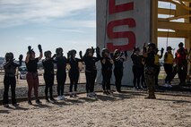 U.S. Marine Corps spouses taking part in the "In Their Boots" event receive a safety brief prior to conducting the rappel tower at Marine Corps Recruit Depot San Diego, Feb. 16, 2024. In Their Boots is designed to inform Marine Corps spouses about the duties of their significant others and give them a peek into the rigors of recruit training. (U.S. Marine Corps photo by Sgt. Jesse K. Carter-Powell)