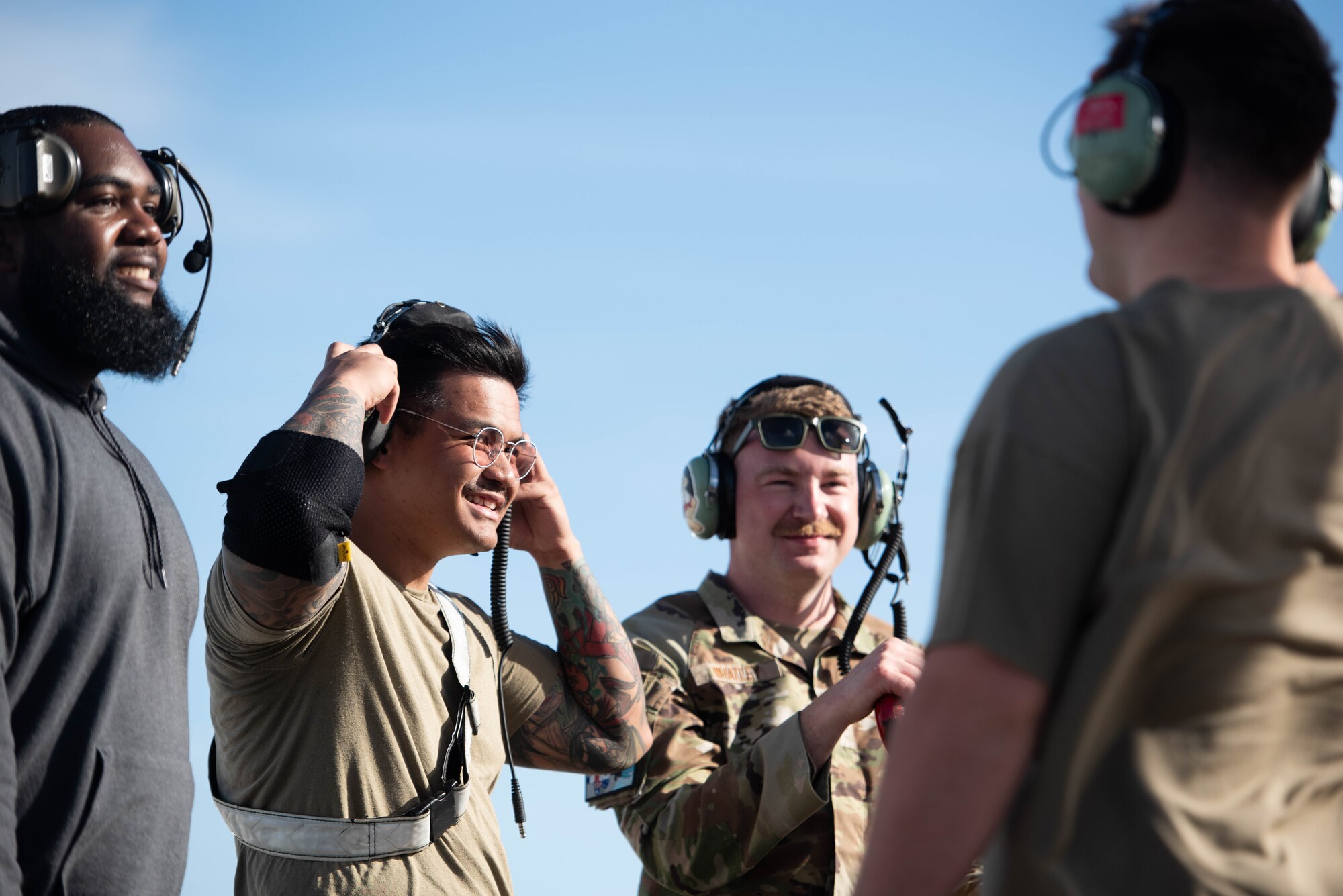 Airmen discuss pre-flight procedures.